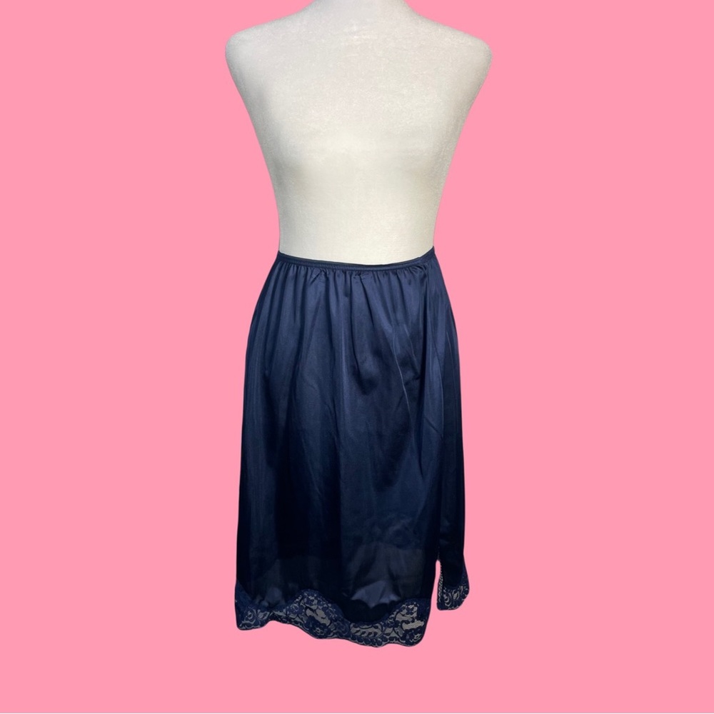 Navy blue slip skirt with lace detailing in the trim